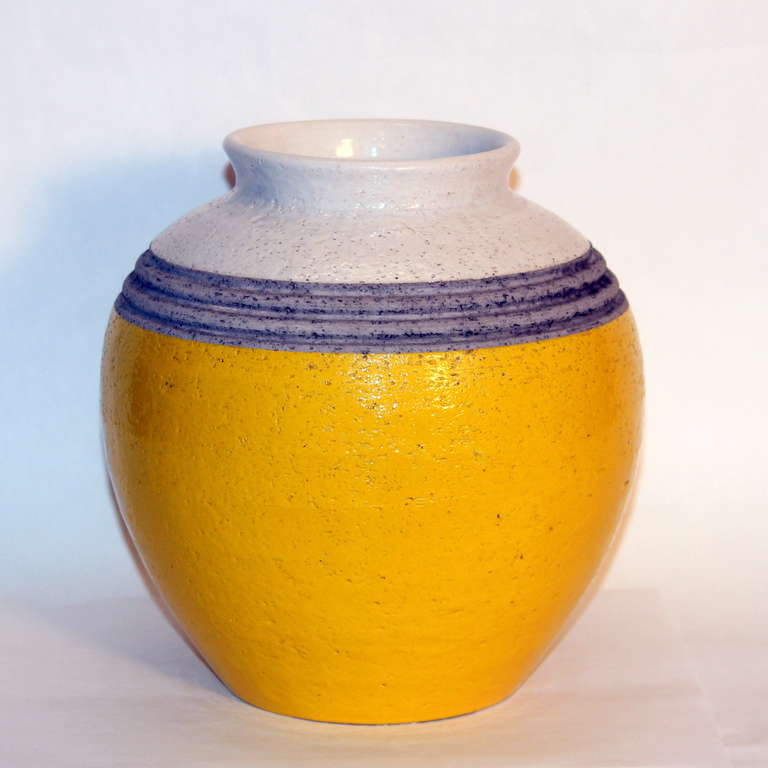 Vintage hand thrown Bitossi rotund vase in sunny and cheerful yellow with white top and incised, unglazed band at shoulder. Great looking piece. 8 1/4