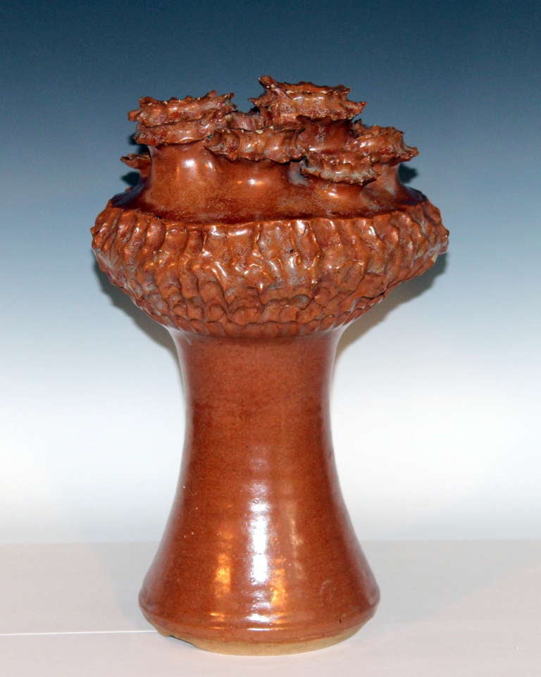 Large studio vase with multiple jagged mouths erupting from the surface of a mushroom like structure deeply scored at the shoulder. Signed and dated 1963. 15 1/4