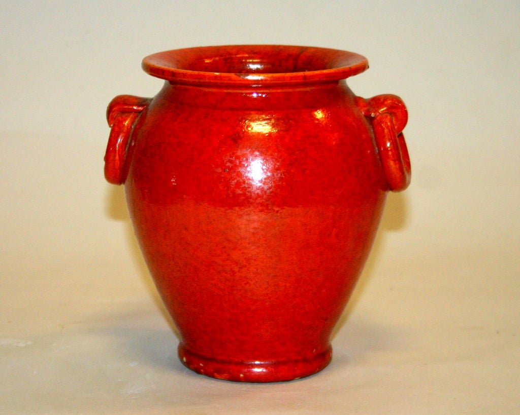 Nice little North Carolina pottery urn with ring handles and terrific atomic, chromium red glaze.