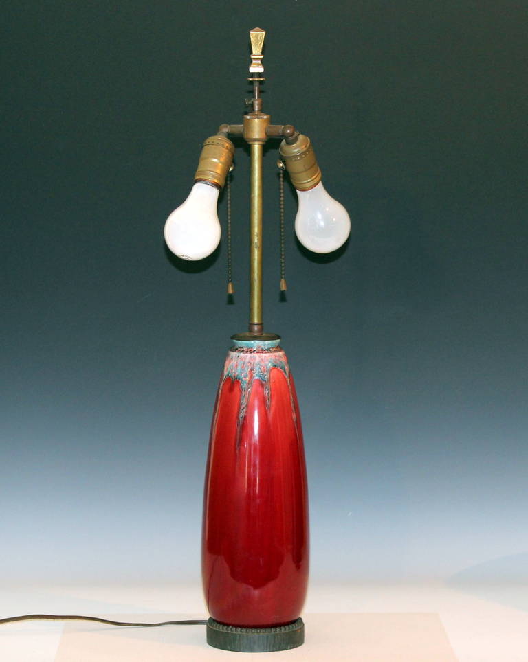 French Art Deco Pottery Lamp in oxblood glaze with flambe drips at shoulder and Loius Katona wrought steel mounts, circa 1920s. Attributed to the wife of Pierre-Adrien Dalpayrat, Marie Dallerie. 26