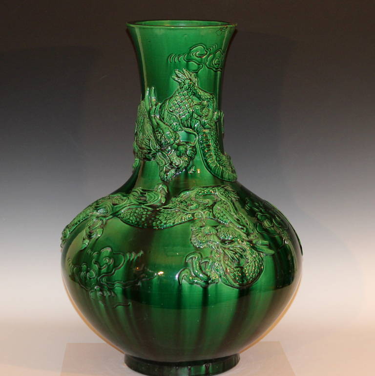 Huge Awaji pottery vase in Hu-form with pair of flying dragons in translucent green glaze, circa 1910. Measures: 26