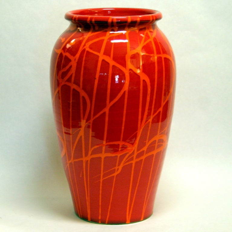 Large hand thrown Italian art pottery vase with orange splashes over fire engine red glaze by the Bellini Studio in Florence.