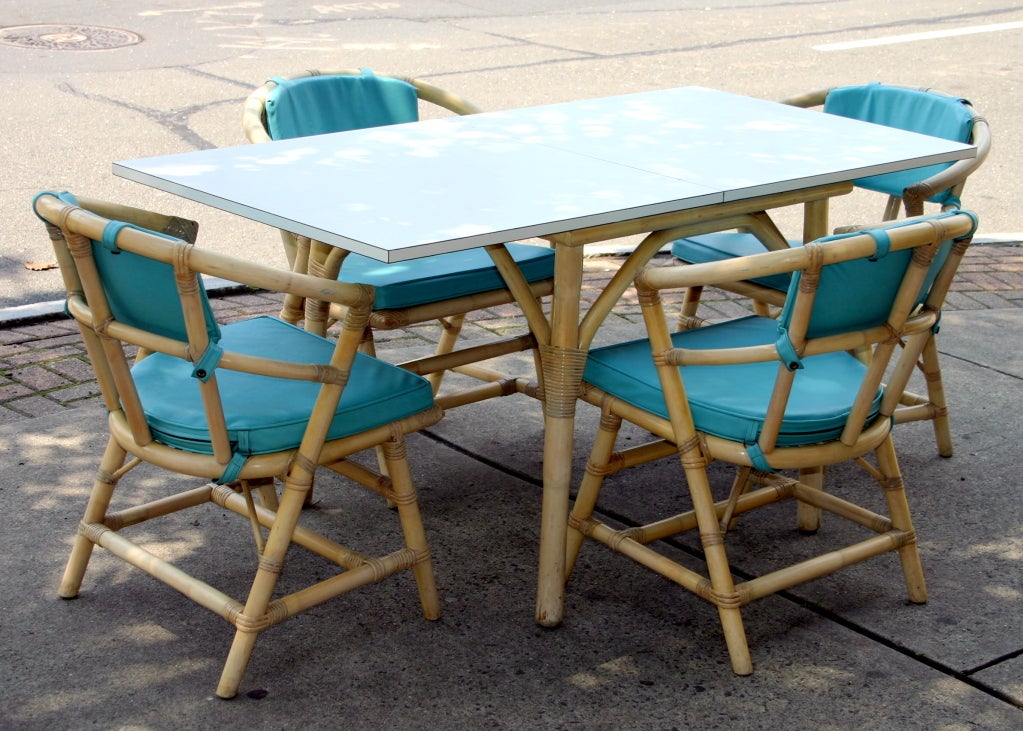 Vintage 1950s Willow and Reed design, often attributed to Tommi Parzinger, flip top white laminate dining table with four armchairs. Original pickled lacquer finish. Table 30
