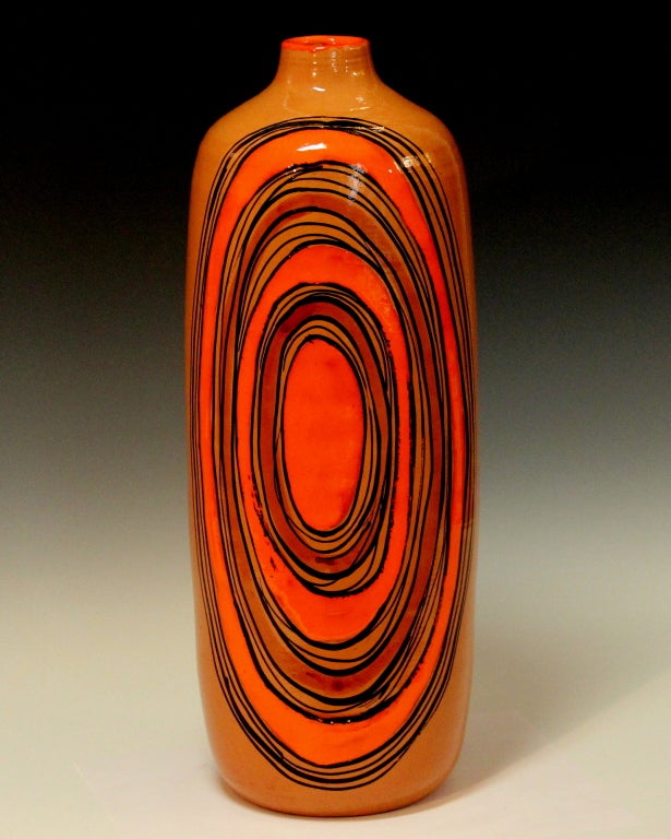 Large Bitossi vintage art pottery vase with the original Raymor sticker, circa 1960's. Each side with striking bull's eye design boldly wrought in black and heavy orange enamel. Original Raymor label with Bitossi code. 17 3/4