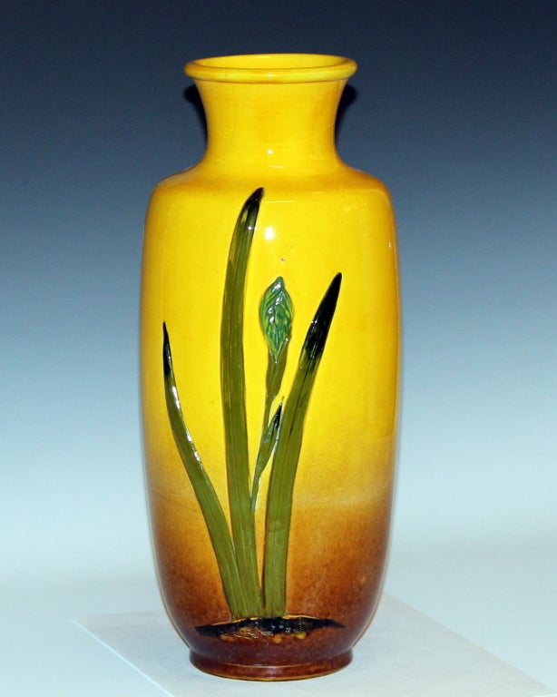 Awaji pottery vase in rich yellow glaze with applied irises in relief, circa 1920s. 14 1/2