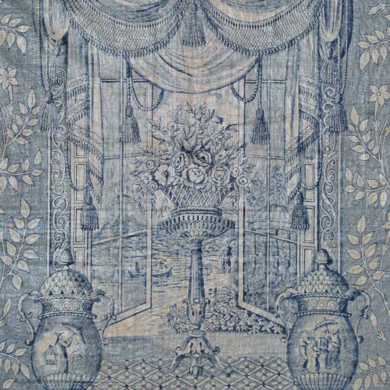 English roller printed cotton in blue on white with a repeated pattern of fashionably draped open windows, flowering baskets and Chinoiserie urns.
