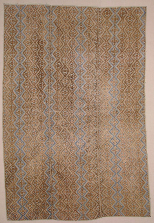 Early 20th century wedding quilt cover Zhuang people, Guangxi Prov.,  south China,  made of cotton and silk brocaded  in a geometric pattern in brown and blue.  Composed of three widths.