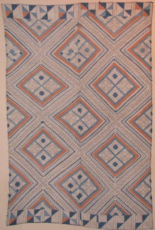Early to mid 20th century from Guizhou Prov., China, Miao people, 2 panel cotton wedding bedcover in blue, white, and rust with a weft faced compound weave and supplementary weft weave in geometric patterns.