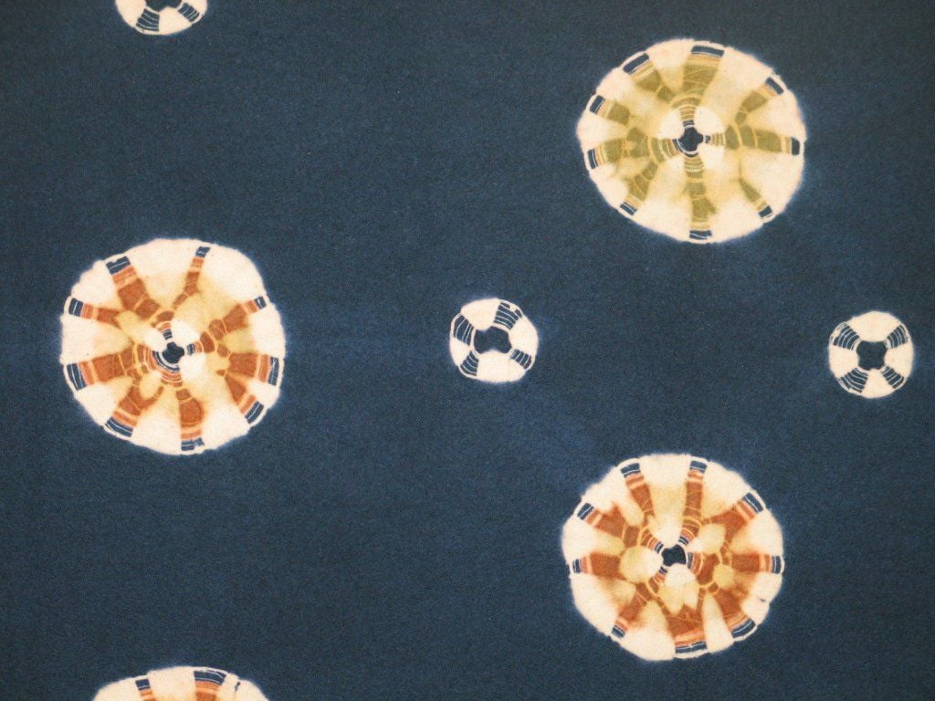 Japanese resist dyed (shibori-zome) wool felt carpet (mosen) in dark indigo with resist roundels further dyed in brown and olive green. Mosen were used in the waiting area of a tea house during the winter months.<br />
<br />
While the wool felt