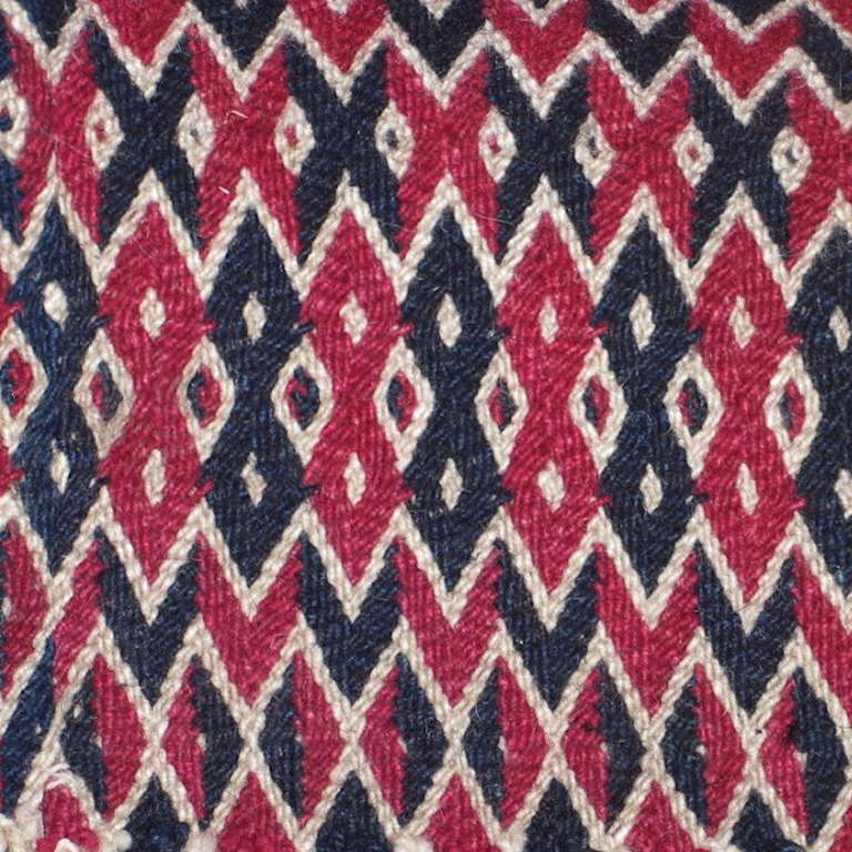 Early 20th century Central Tibet wool cord, split ply and braided cover (nargatzi) red, navy, and white.