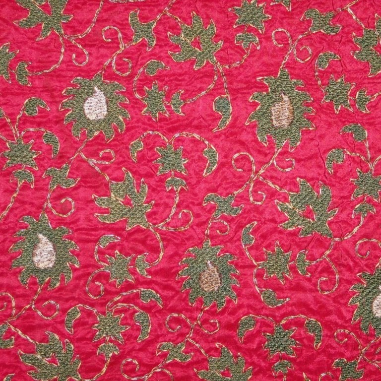 19th century Ottoman (Turkey) cover with  green silk and metallic embroidery, done in laid and couched work, on raspberry colored silk ground in a repeated floral pattern.