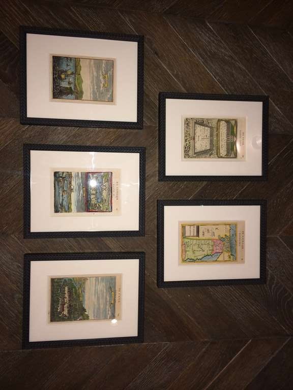 Colorful framed vintage book pages.