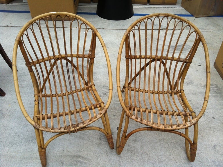 A beautiful pair of Rattan Armchairs.  Found in France during one of Nathan's travels.