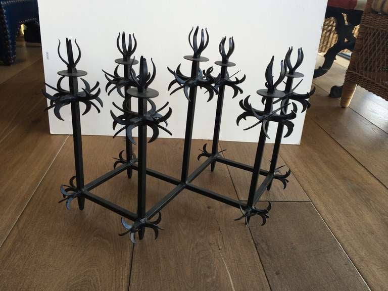 Ornate black iron candelabra.