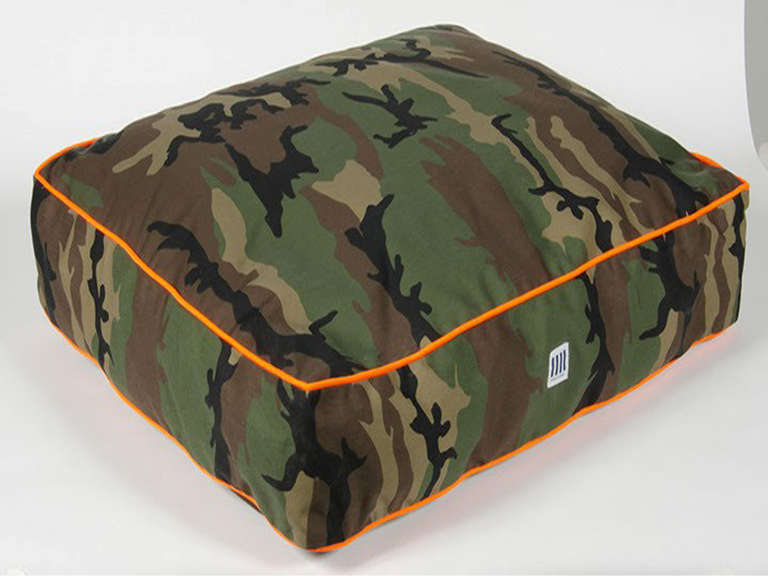 Camo dog bed with orange trim & down alternative blend.