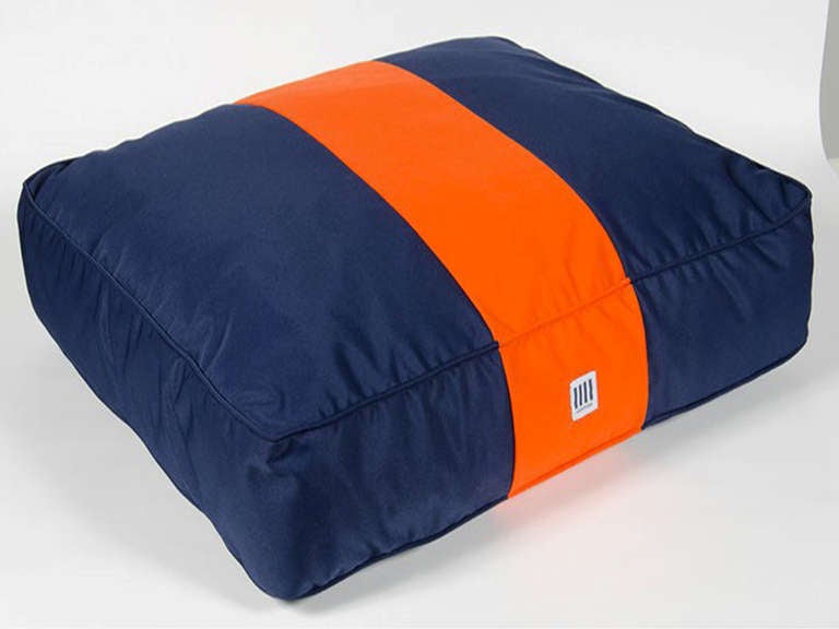 Orange color blocked dog bed with down alternative blend. By Nathan Turner.