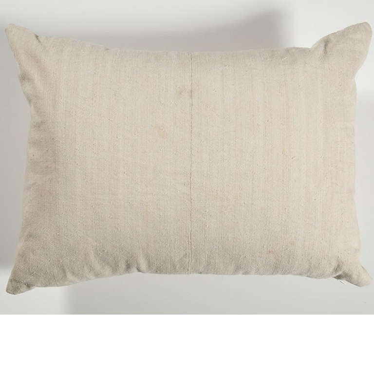 a pillow made with antique french linen