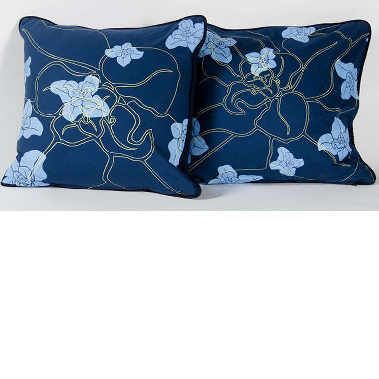 blue pillow with orchid flower motif