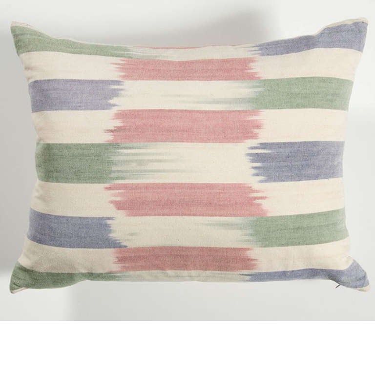 Red, Blue, and green striped ikat style pillow.