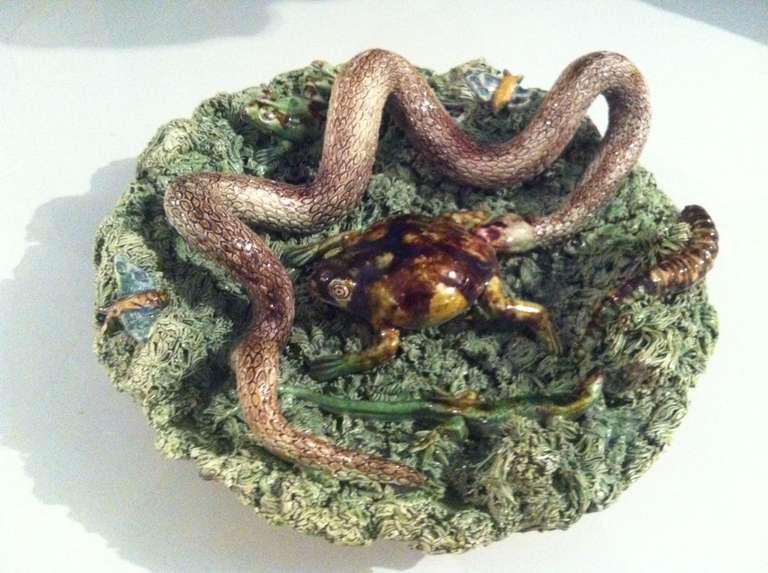 An intriguing Portuguese palissy ware by Jose A Cunha from Caldas de Rainha, Portugal. Look closely and you'll see a snake, frog and other insects.