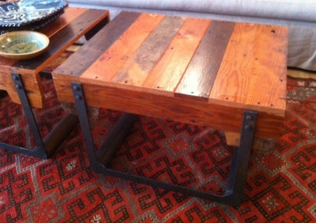Beautiful industrial rolling side table made from reclaimed wood.