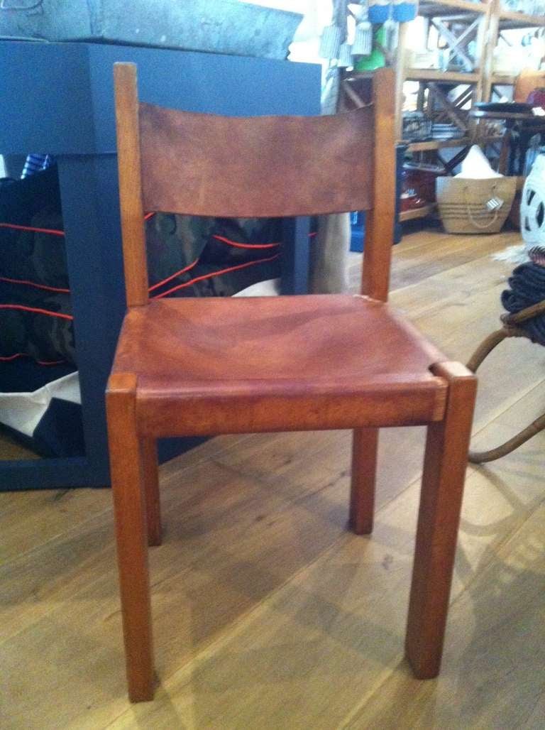 A gorgeous group of Four 19th c Leather & Wood Side Chairs.  Found by Nathan Turner in France.