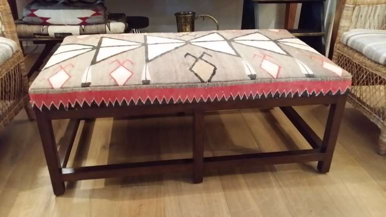 A beautiful custom Ottoman Upholstered with Vintage Navajo Rug.