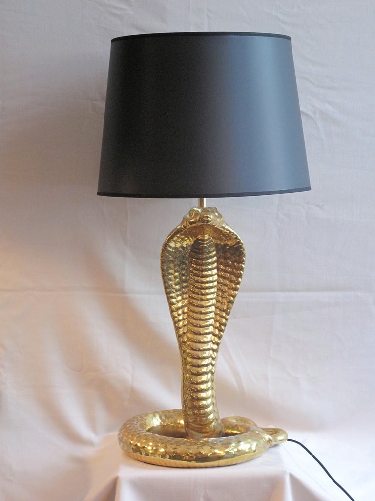 Unique gold-glazed cermaic table lamp in the shape of a cobra. A fine work signed by Tomasso Barbi, dating to the 1970s.
