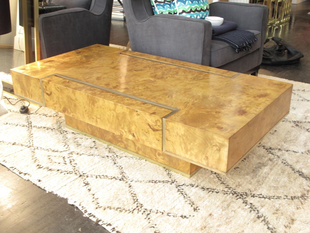 Vintage rectangular burlwood coffee table on pedestal base with brass banding detail and two inset drawers.