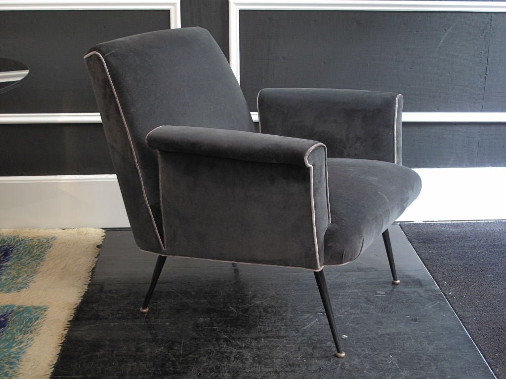 Vintage Italian armchairs, newly upholstered in charcoal velvet with contrasting welt and metal legs. Two available.