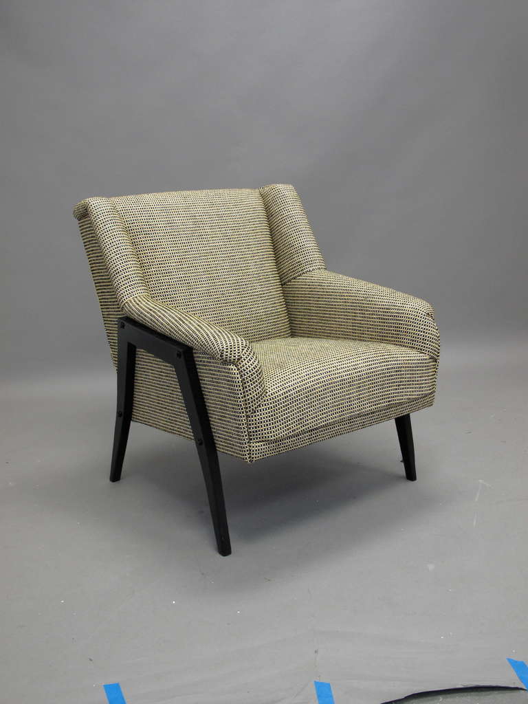 Rolled arm chair in gold, white and black wool upholstery on exposed black wood U-shaped legs. Italy, 1950's