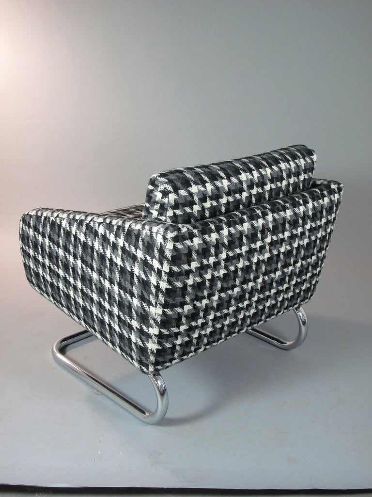 Vintage Italian cantilevered chairs on chrome bases, newly reupholstered in a black, white, and grey houndstooth fabric. Priced as a pair, available individually.

If you would like to see this piece in person, please contact us to schedule a