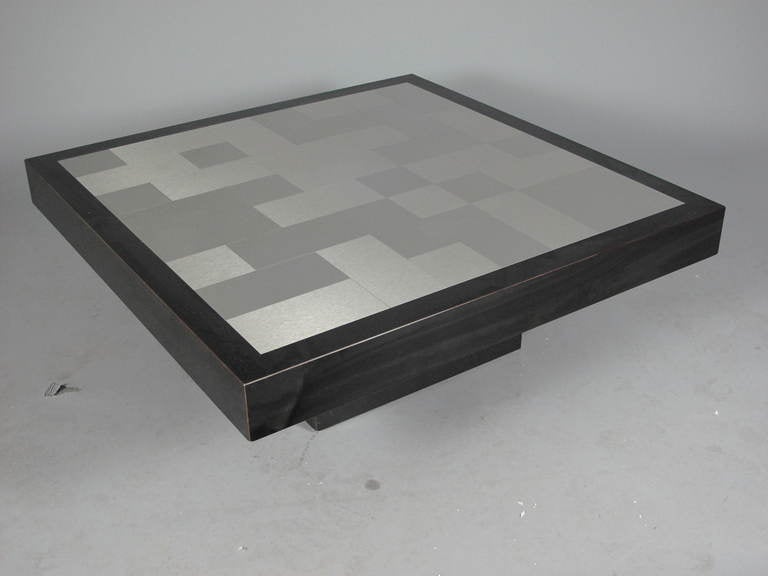 1970's French square coffee table with inlaid bushed and polished stainless steel patchwork tile top and black base.