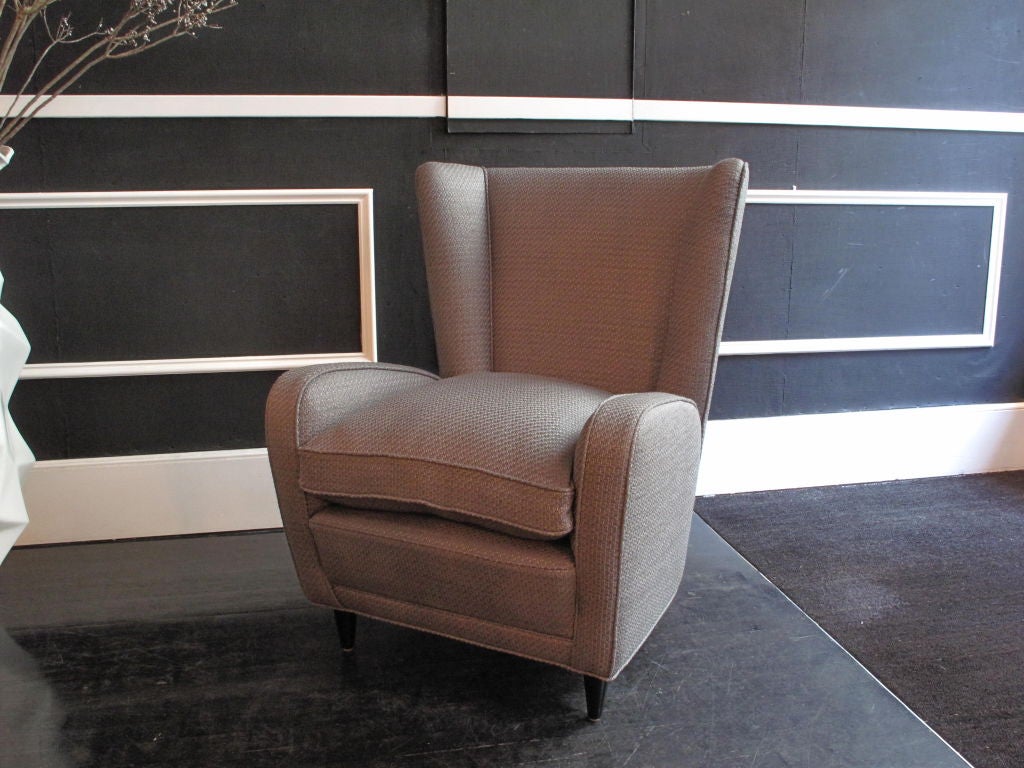 Pair of vintage Italian high back wing chairs by Paolo Buffa, newly upholstered in grey tweed. Priced as a pair; available individually.<br />
<br />
As this piece may be in our off-site storage, please call ahead to schedule a viewing.