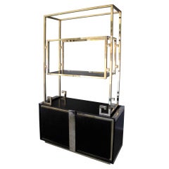 1970
s French Brass Etagére with Ebonized Wood Cabinet