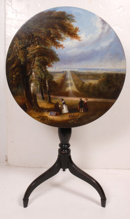 American cherry  tilt  top,  baluster turned   candle stand  on spider legs.  Connecticut Valley circa  1800. The  base has been  ebonized and fitted with an English circular table top circa l835 painted with a rural landscape with figures, framing