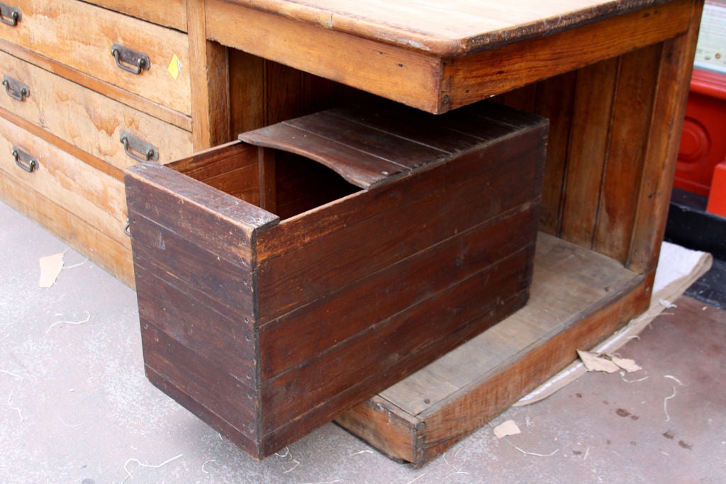 This table was practically designed for storage and function.  Signs of age and use add character.