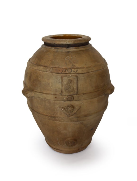 This olive pot was made in Purgia, by the best factory in Italy.  It carries their stamp.