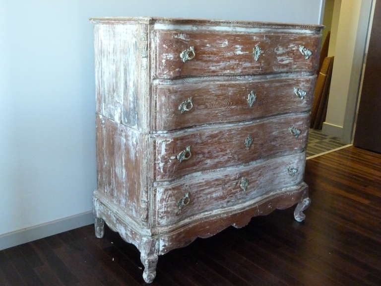 Five drawer chest with serpentine shaped front, ornate brass hardware, and beautiful distress finish as found.