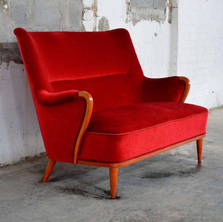 Beautifully stylized Art Moderne Settee Sofa Loveseat from 1940's Sweden. Upholstered in original cherry red velvet. Price includes reupholstery in COM fabric.

Additional Dimensions:
54