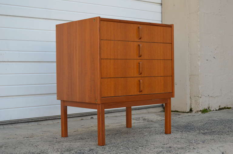 Swedish modern mid-century four drawer chest/night stand in beautiful teak. Produced by Bodafors in the 1960's, this gorgeous chest was designed and constructed to the highest standards. In excellent original condition with unique vertical teak