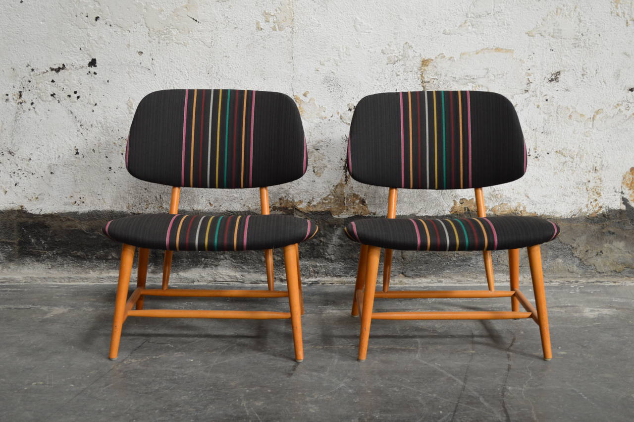 Pair of Mid Century TV chairs by Alf Svensson for Ljungs Industrier AB. Padded seat and backrest recently upholstered in durable Sunbrella fabric.

Measures: Height: 27.5 in. (70 cm).
Width: 24 in. (61 cm).
Depth: 23 in. (58 cm).
Seat height: