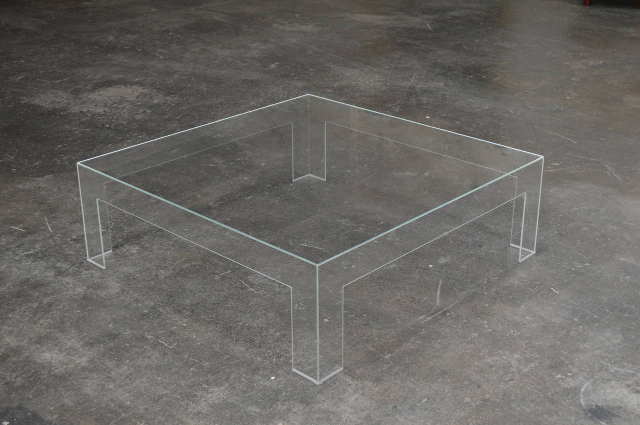 Modern square lucite ghost coffee table. Beautiful vintage condition and a great piece for a room with a rug that you want to be seen.