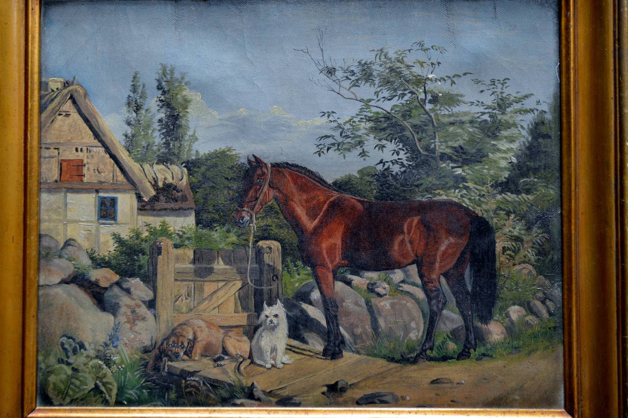 Unsigned oil on linen painting in distressed guilt frame. An Flemish oil painting of a horse and dogs in a romantic cottage landscape.