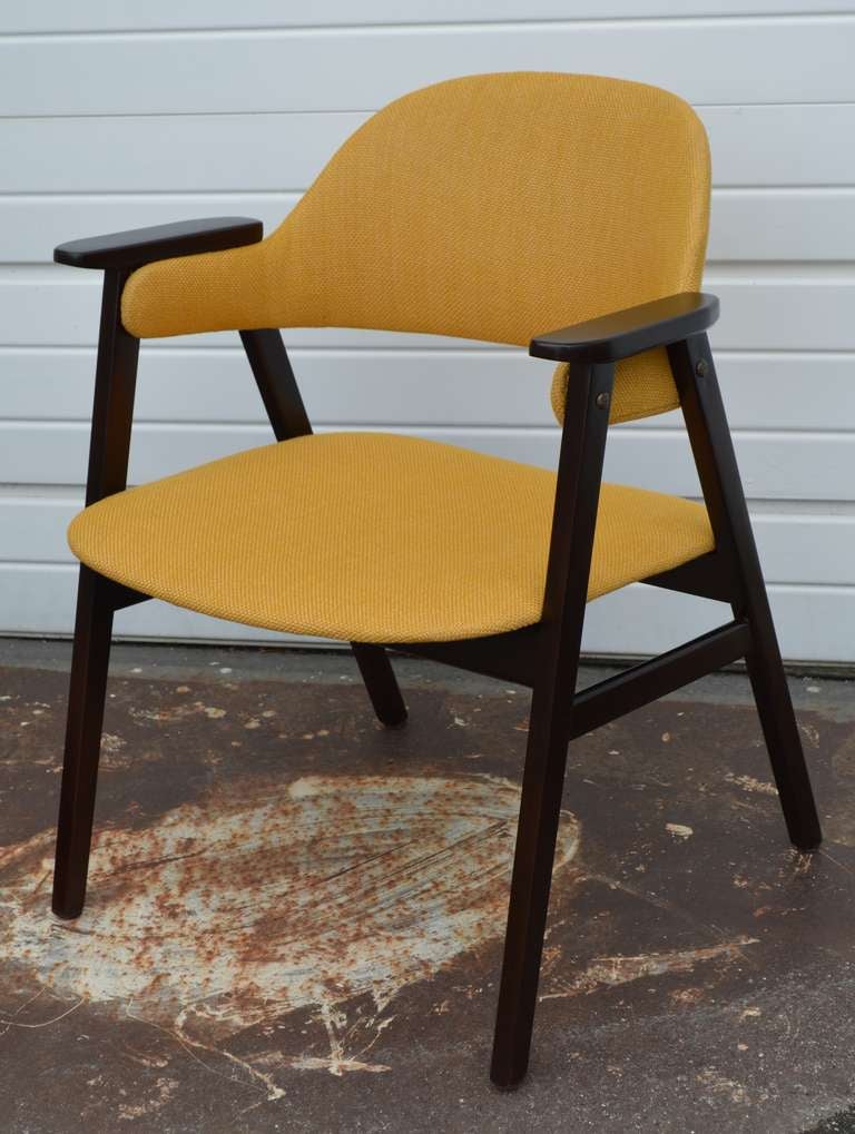 Mid Century Modern teak side arm chair in a espresso finish with new sunny yellow upholstery. Beautiful sleek and elegant design. A great addition to any room.