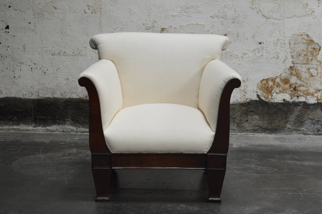 Extraordinary pair of restored vintage Empire Revival arm chairs. Crafted in mahogany and newly restored and upholstered in cotton duck and COM ready. Sturdy hardwood frames and eight-way hand-tied springs. Exquisitely tailored,. very comfortable