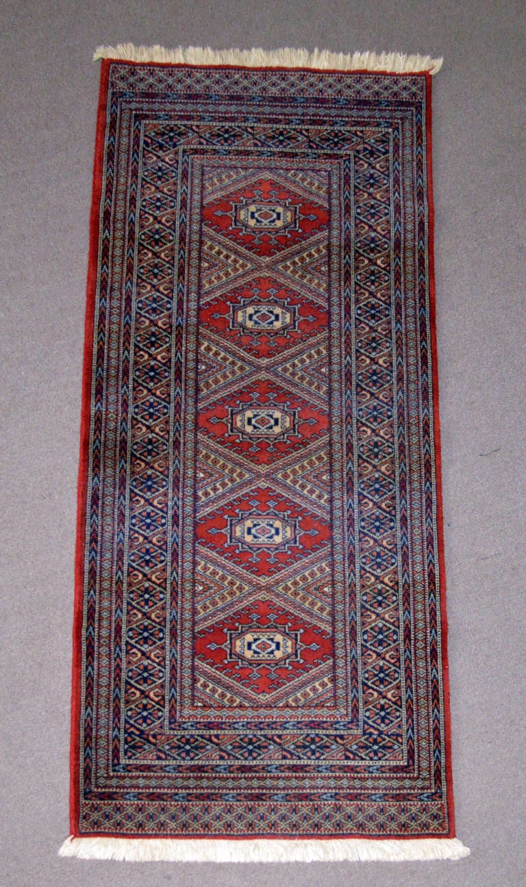 Vintage Belgian Wool Jacquard Machine Woven Rug or Runner .

A perfect jacquard woven reproduction, of a carpet hand-made by nomads who live in the vicinity of the Ashkhabad centre in Turkmenistan Russia.