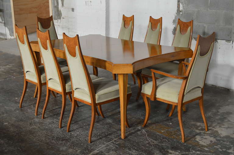 This is a significant and rare set of eight upholstered fruitwood 