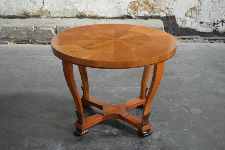 Swedish Art Deco round golden elm end or side table. Beautifully detailed with flame birch.