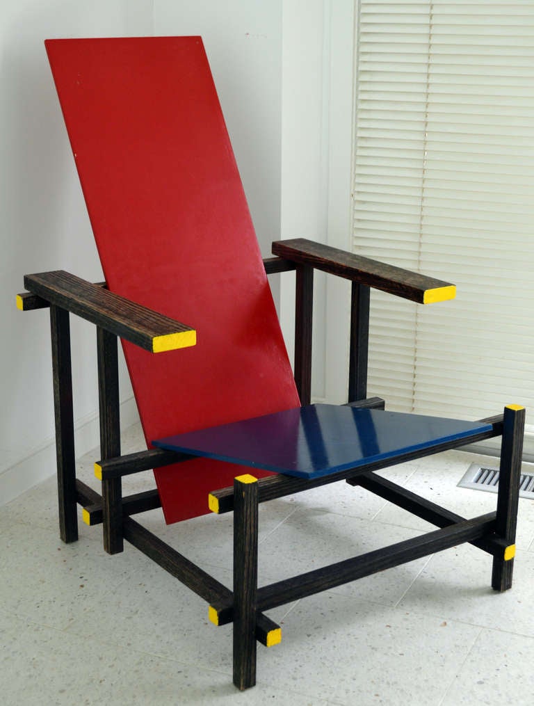 Originally Designed by Gerrit Rietveld in 1917, this reproduction chair is an icon of Modernism, and a symbol of the Dutch De Stijl design movement.  Truly, a functional piece of art.  This chair is a reproduction and was handmade by a craftsman